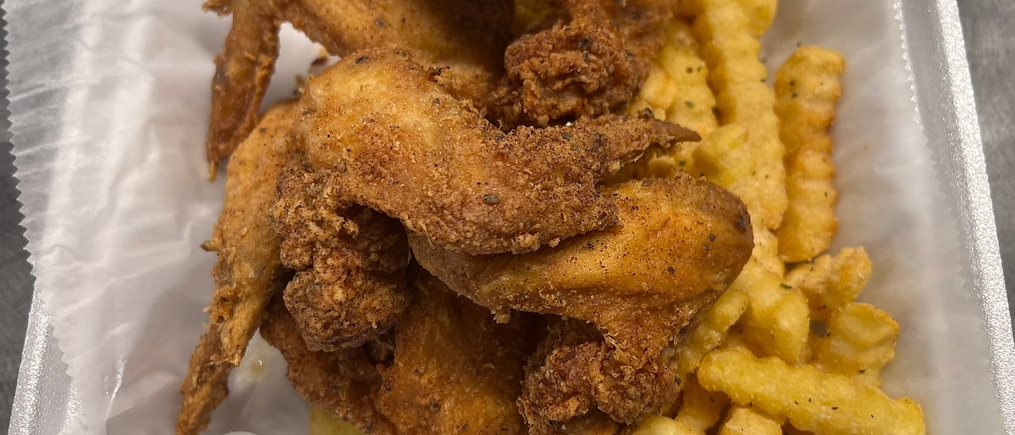 Golden breaded whole wings, crispy and fresh out of the fryer